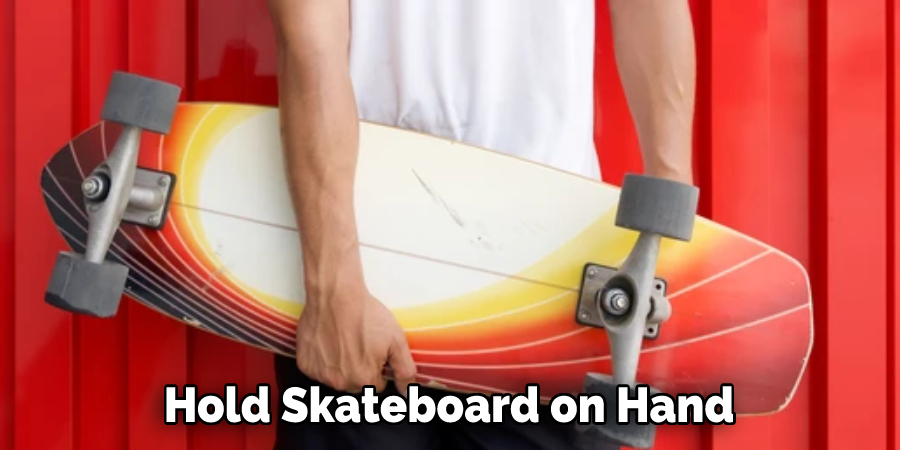 Hold Skateboard on Hand