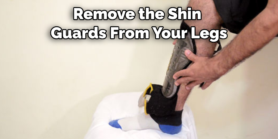 Remove the Shin  Guards From Your Legs